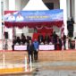 Sekretaris Daerah (Sekda) Kabupaten Konawe, Dr. Ferdinand, SP., MH., memimpin langsung upacara peringatan Hari Kebangkitan Nasional (Harkitnas) ke-117 di halaman Kantor Bupati Konawe, Senin (20/5/2025). Upacara yang dihadiri oleh pejabat eselon II, III, IV, Forkopimda, ASN, dan P3K ini mengusung semangat kebangsaan serta refleksi atas tantangan modern.