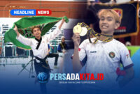 Rahmat Lagaligo mengibarkan Bendera Lambang Daerah Konawe: Rahmat Lagaligo dengan gagah mengibarkan bendera kebanggaan Kabupaten Konawe usai dinobatkan sebagai juara di Kejurprov Taekwondo Sultra 2026.