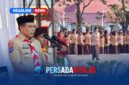Bupati Konawe, H. Yusran Akbar, ST, memberikan arahan dan membacakan sambutan Ketua Kwarnas Gerakan Pramuka saat memimpin upacara HUT Pramuka ke-65 di Lapangan Pemda Konawe, Jumat (14/8/2026). Ratusan anggota Pramuka dan pembina tampak mengikuti apel dengan khidmat di bawah cuaca cerah.