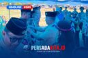 Penyematan Tanda Jabatan: Momen khidmat saat H. Syamsul Ibrahim menyematkan tanda jabatan kepada salah satu pengurus Kwartir Ranting yang baru dikukuhkan, menandai dimulainya masa bakti 2026-2029.