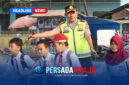Aksi humanis Kapolres Konawe, AKBP Edi Raharjono, S.I.K., M.Si   memastikan anak-anak sekolah tiba di seberang jalan dengan selamat.